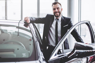 Wall Mural - Businessman near car