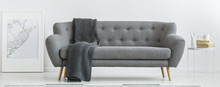 Grey Couch With Blanket