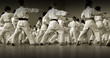 Children's training on karate-do. Banner with space for text. For web pages or advertising printing. Photo without faces, from the back.