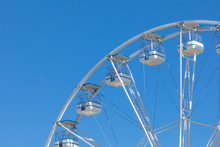 Ferris Wheel Municipal Park With Blue Clear Sky On The Background