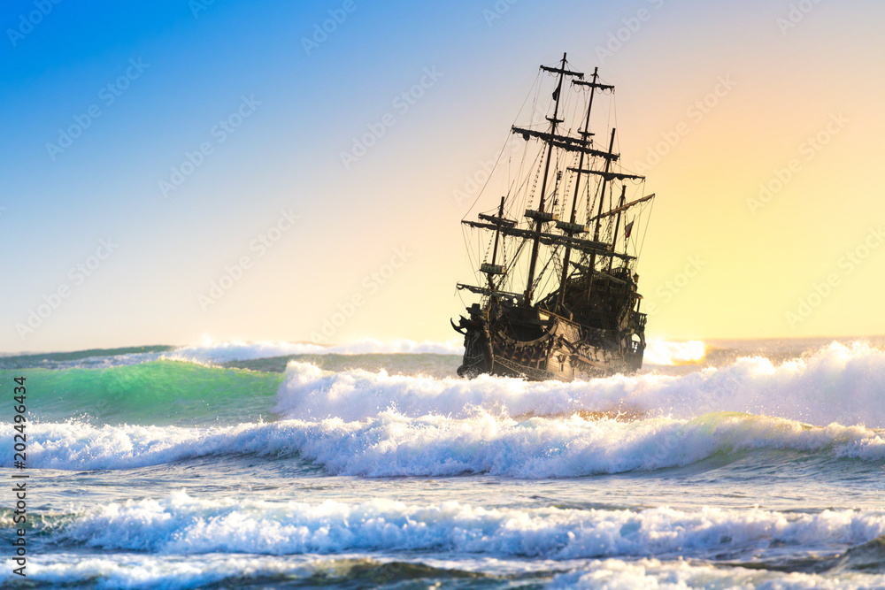 Pirate ship at the open sea at the sunset Stock Photo | Adobe Stock