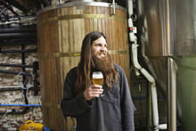 Portrait Of A Male Beer Brewer In A Brewery