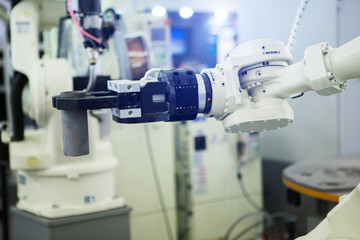 Aufkleber - A robotic arm. Automatic robot in a smart factory. Assembly line