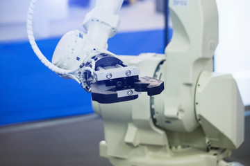 Aufkleber - A robotic arm. Automatic robot in a smart factory. Assembly line