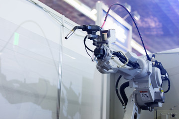 Poster - Automatic welding robot in a modern factory in operation. 