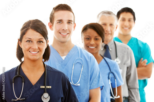 Fotografie, Obraz Doctors: Female Nurse Heads Line of Medical Professionals