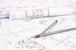 © bayurov - Pencils and paper еngineering house drawings and blueprints.