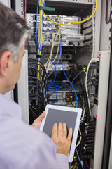 Aufkleber - Technician controlling the server with a digital tablet
