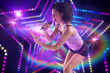 © vectorfusionart - Pretty girl singing against digitally generated star laser background