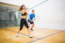 Couple Play Some Squash Together