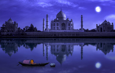 Fototapete - Taj Mahal Agra in full moon night with wooden boat on river Yamuna. Photograph shot from Mehtab Bagh.