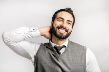 Wall Mural - Portrait of happy bearded eastern smiling businessman on isolated white background