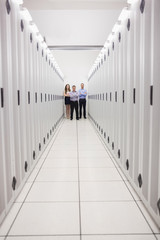 Aufkleber - Technicians standing at end of server corridor