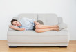 © WavebreakmediaMicro - Well dressed young woman sleeping on sofa