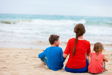 Mother and two kids at tropical beach