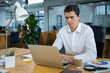 © WavebreakmediaMicro - Man using laptop at desk