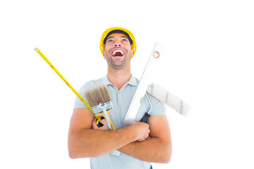 Poster - Laughing manual worker holding various tools