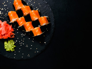 Wall Mural - sushi rolls set on dark background. Asian food. Traditional Japanese cuisine.