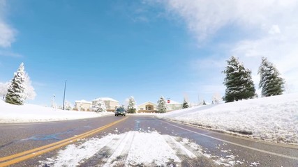 Wall Mural - Denver, Colorado, USA-March 27, 2018-POV-Driving on suburban road after the Sping snow storm