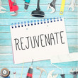 canvas print picture - The word rejuvenate  against tools and notepad on wooden background
