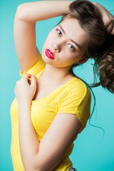 Wall Mural - Close up portrait of a young beautiful brunette woman looking at camera.