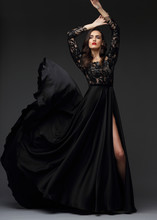Young Elegant Woman In Long Black Dress.