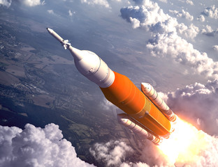Wall Mural - american space launch system flying over the clouds