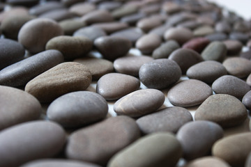 Many stones of different shapes and shades.Background.