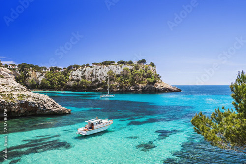 Fotomural Beautiful bay with sailing boats and yachts, Cala Galdana, Menorca island, Spain
