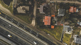 Fototapeta Mosty linowy / wiszący - Aerial View On Freeway And Village