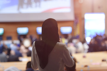 Muslim business woman having presentation during regional business investment conference