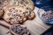 Chocolate Cookies On Wooden Table With Flour Eggs And Ingredients