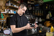 © bokan - Male barista making payment