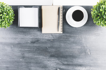 Canvas Print - Wooden desk top with notepad and coffee