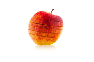 one sliced red juicy apple on a white background