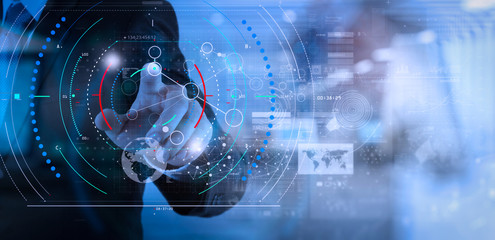 Poster - businessman hand working with modern technology and digital layer effect as business strategy concept