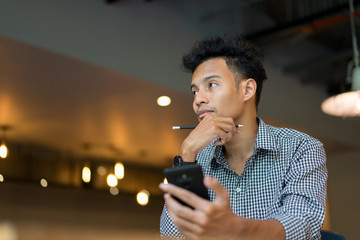 close up asian employee man thinking idea at office room concept