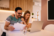 © Nebojsa - Young couple is smiling while they have Skype call with friends