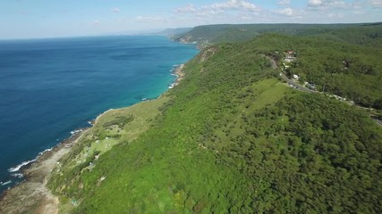 Wall Mural - Drone flight along breathtaking ocean coastline along Grand Pacific Drive near Sydney Australia