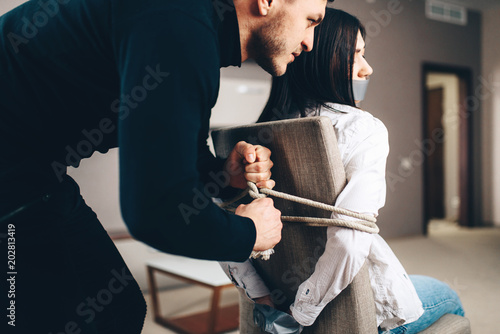 Robber Maniac Tied Female Victim To A Chair Buy This Stock Photo And
