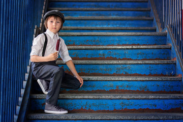 Wall Mural - Little preschool boy, cute child, dressed in vintage style clothes, eating ice cream