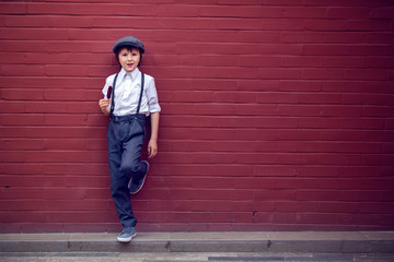 Wall Mural - Little preschool boy, cute child, dressed in vintage style clothes, eating ice cream