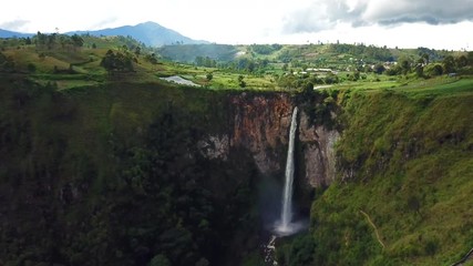 Wall Mural - AERIAL 4K:  Fly Cam around  Sipiso Piso waterfall, Northern Sumatra, Indonesia