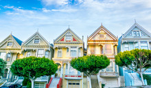 Late Afternoon Sun Light Up A Row Of Colorful Victorian Houses Known As Painted Ladies Across From Alamo Square. The Historic Houses Were Built Between 1892 And 1896.