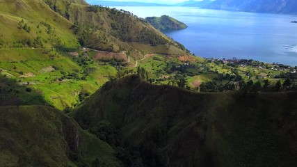 Wall Mural - AERIAL 4K: Flying over trees to view of Toba lake, the most popular touris destination in Indonesia