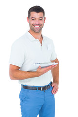 Poster - Smiling handyman with clipboard on white background