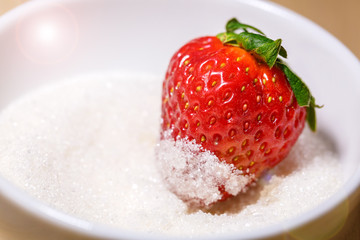 Sticker - fresh red strawberry on a plate in sugar