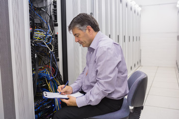 Aufkleber - Technician writing notes on the servers