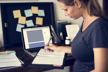 Wall Mural - Pregnant woman is working