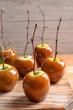 Delicious green caramel apples on table